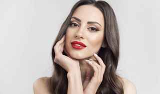 picture show's a beautiful woman wearing a natural cami lace top wig in a stunning and realistic brunette color. Wig is long and layered.