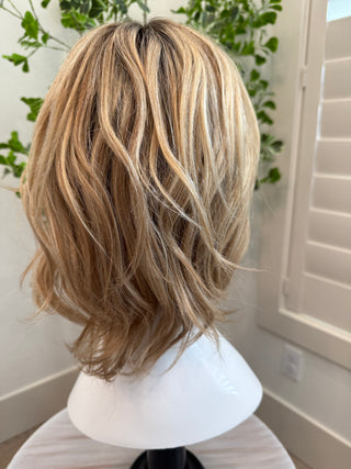 View of 15” hand tied European hair wig  indirect lighting 