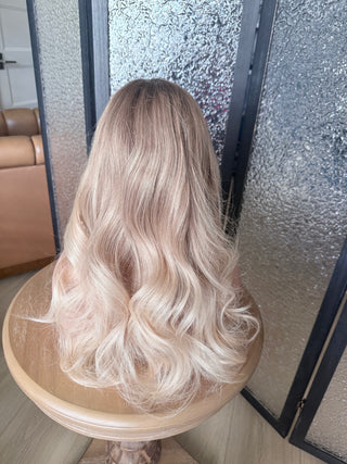 Dimensional champagne blonde Remy human hair wig with taupe root from the back