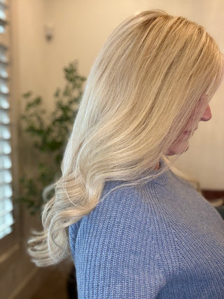 view of full density blonde wig indoors